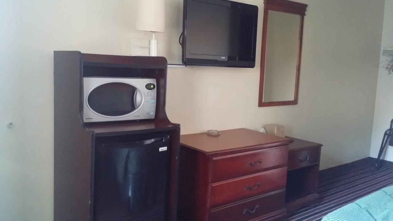 Carpet Inn Опелика Экстерьер фото