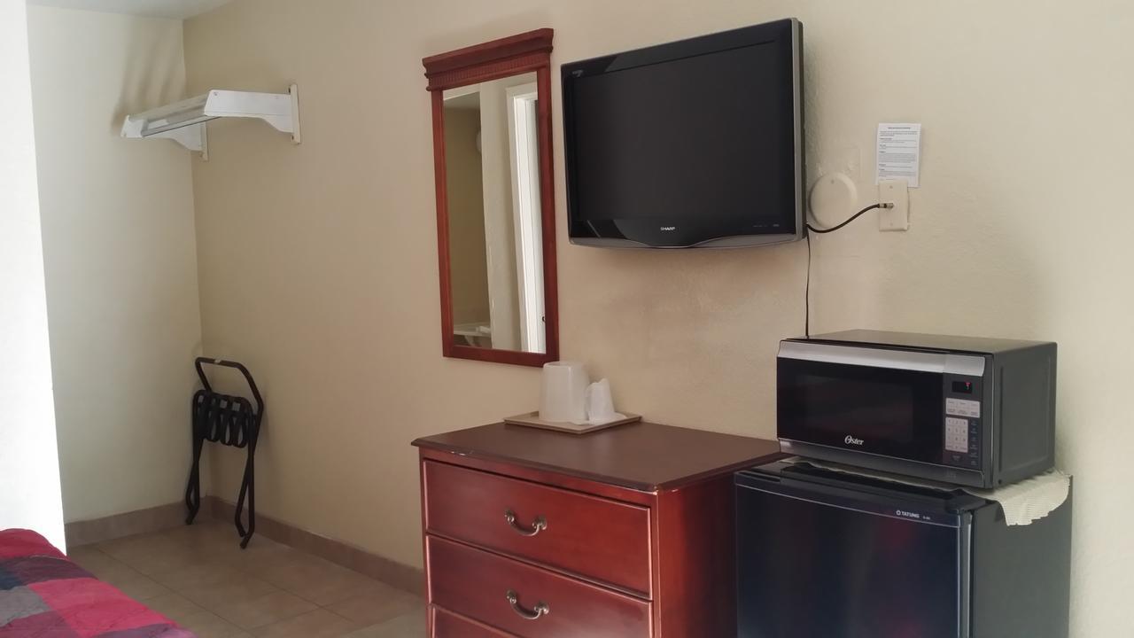 Carpet Inn Опелика Экстерьер фото